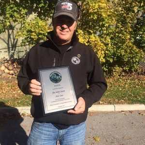 Mike Clark receiving the Jim Aitkin Award for his outstanding contribution to the OASIS Board, October 2015